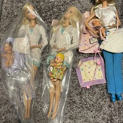 Three I can be a doctor Barbie dolls with babies