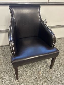 Black faux leather armchair