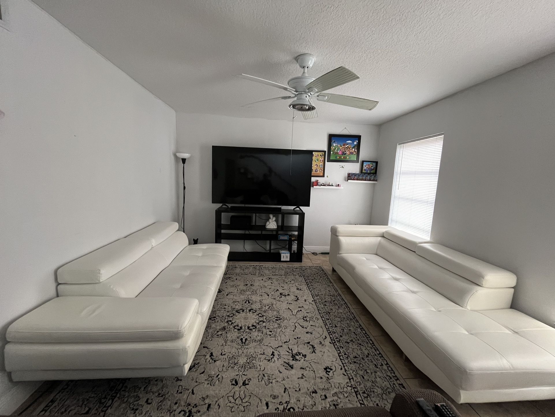 2 white leather sofas, $400