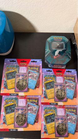 Pokémon TCG Lot – 4 Blister Packs & Darkrai Tin