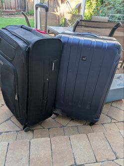 two jumbo suitcases luggage (poor shape) - good as storage or moving boxes