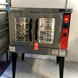 Like new, barely used...Vulcan stainless steel Electric double-door convection oven with digital controls..