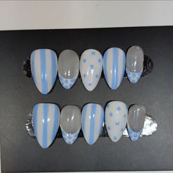 These are handmade, white and blue Press ons! GLUE AND PREP INCLUDED!!
