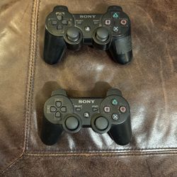 Two PlayStation three remotes