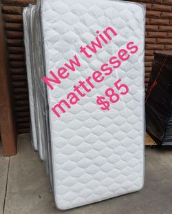 New twin mattresses $85