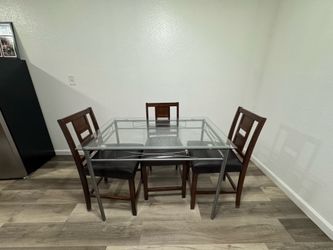 Glass table and 4 wooden chairs