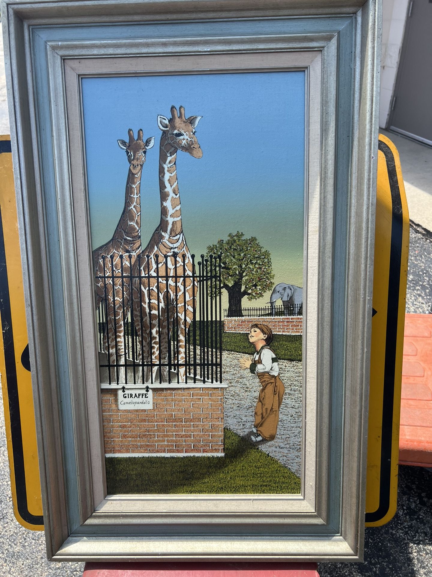 Vintage oil painting framed by H. Hargrove titled "Boy with Giraffes” with certified seal on back