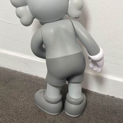 This is an KAWS Companion Flayed Open Edition Vinyl Figure in the Grey colorway, released in November 2016