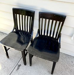 Two black wood dining bistro chairs