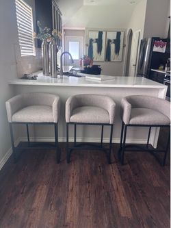 3 Grey upholstered counter height barstools