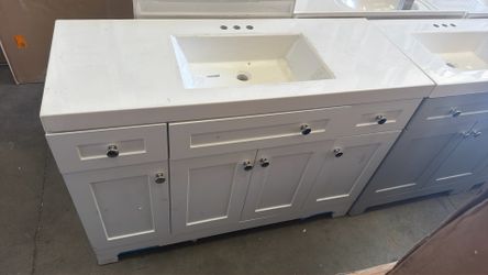 48 in vanity bathroom in white . top with scratches . $399