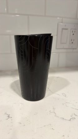 Black Starbucks coffee cup