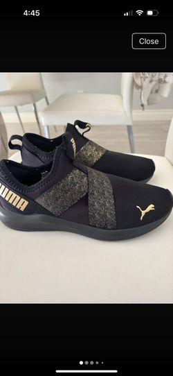 Puma black and gold sneakers