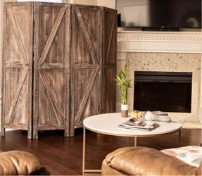 Rustic room divider is made of barnwood with a brown finish. This four-panel partition has a K-pattern design and includes removable stability feet.