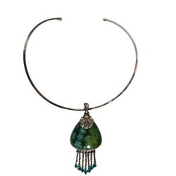 green chicos pendent with dangling silver chains and beads