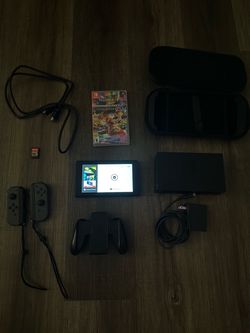 Nintendo Switch with Mario Kart Deluxe and Legends of Zelda Breathe of the Wild