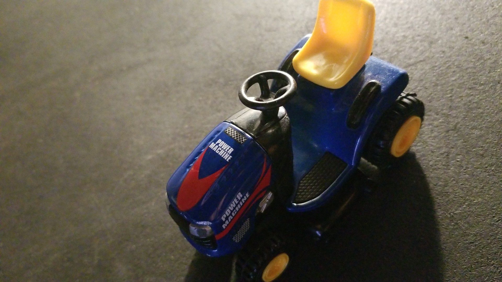 Lawn mower. Hand toy. 6 inches in length