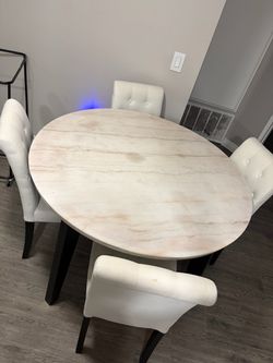 Marble table with chairs.