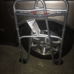 New folder adjustable walker with wheels only $25 firm