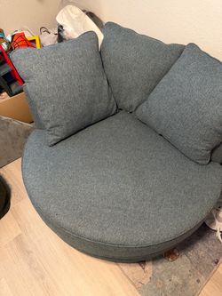 HomeGoods blue round rotating couch