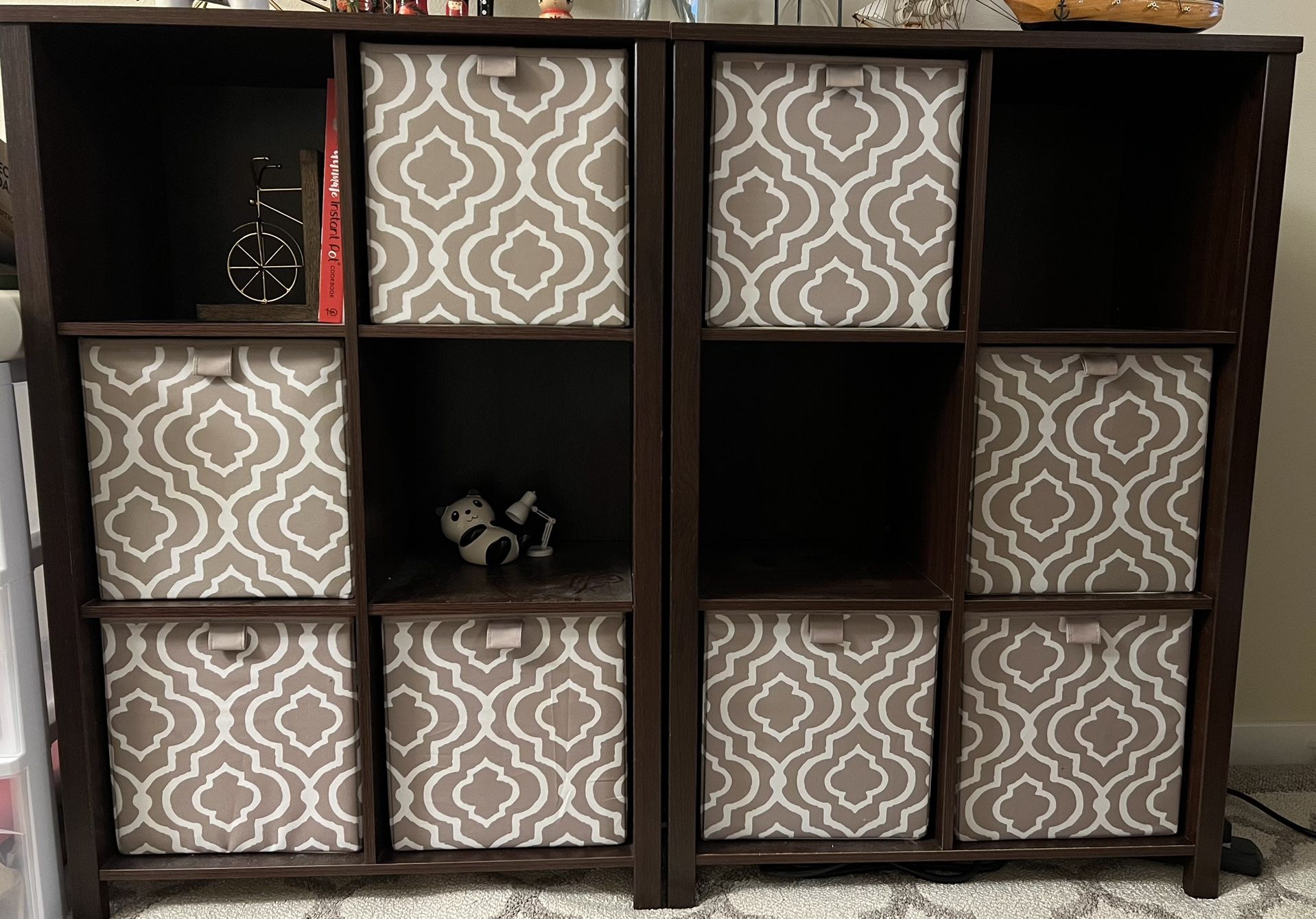 Two Brown Shelves With Baskets