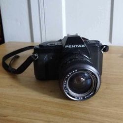 Camera
Pentax P3n p30 With Lens 
52 Japan Tokina lens 35-70mm szx
