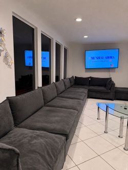 Large Charcoal Modular Sectional Sofa with Blue Accent Pillows - Like New