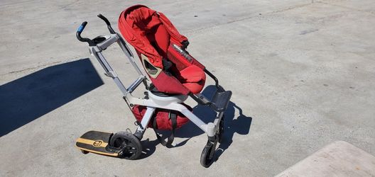 Stroller With Side Skateboard Attached