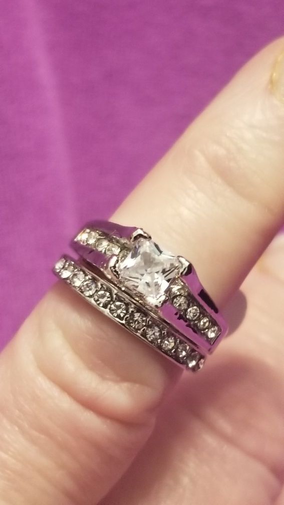 Brand new stainless steel 2 piece wedding set with AAA white cz's.