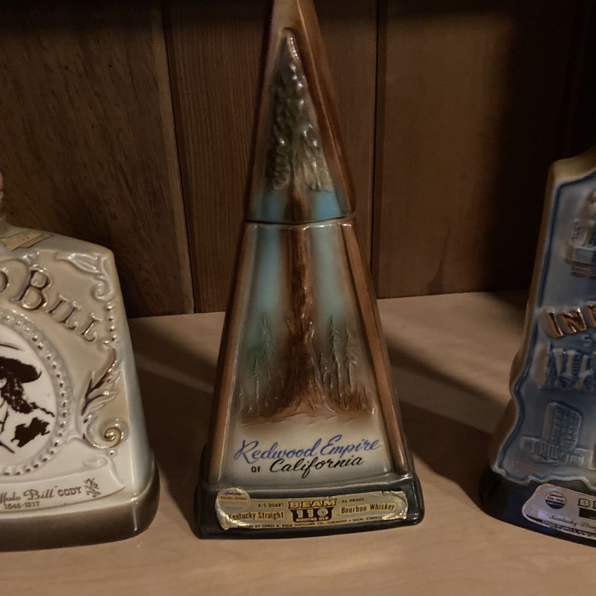 Jim Beam Bottles with all tops and seals 2 half full