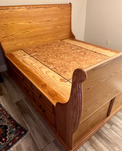 Black Hawk Cal King sleigh bed with matching armoire