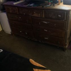 9 Long Drawer Dresser has a little bit of scuffing marks and is missing a couple knobs. It does come with a mirror that goes on the back of it.