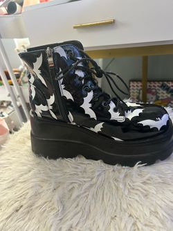 Black and white bat platform boots