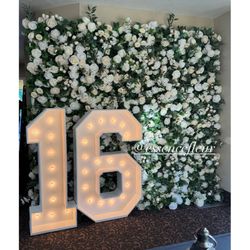 Flower Backdrop, Marquee Numbers And Candy Cart