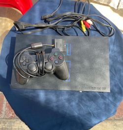 Fat PlayStation 2 with games and memory cards