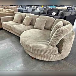 Beige corduroy sectional sofa with round chaise