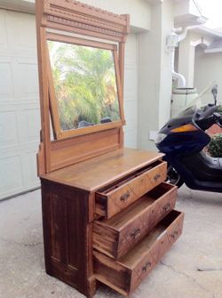 Antique dresser with three spoon carved drawers swivel mirror and original hardware