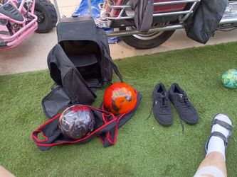 two bowling balls and bowling shoes size 13shoes