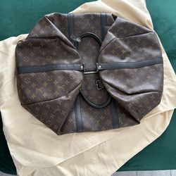 Louis Vuitton Keepall Bandoulière 55 Monogram Macassar duffle bag