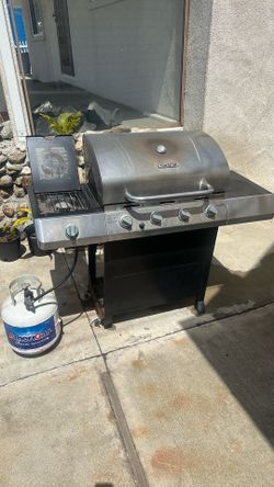 Charbroil Gas BBQ grill with side burner and shelf.