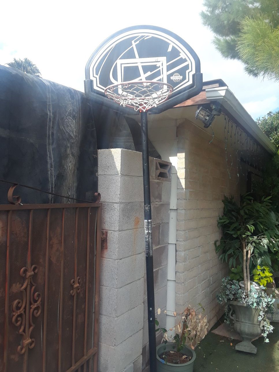 Basketball hoop, good condition on stand with wheels .... make an offer