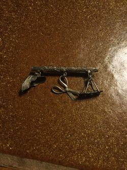 Sterling silver vintage pin with 3 sterling charms