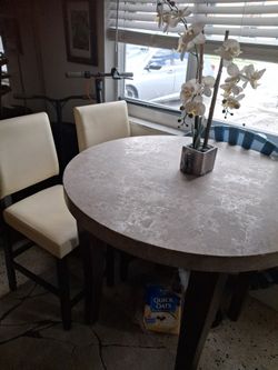 Kitchen.\n Table with 4 leather bartop chairs and table granite. Top excellent condition. Super low sale deal for only 129g 99 0B o