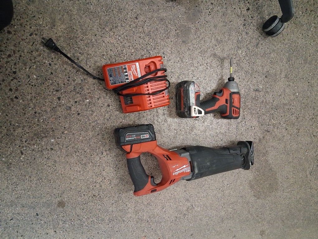 Sawzall And Impact Drill With 2 Batteries And Charger