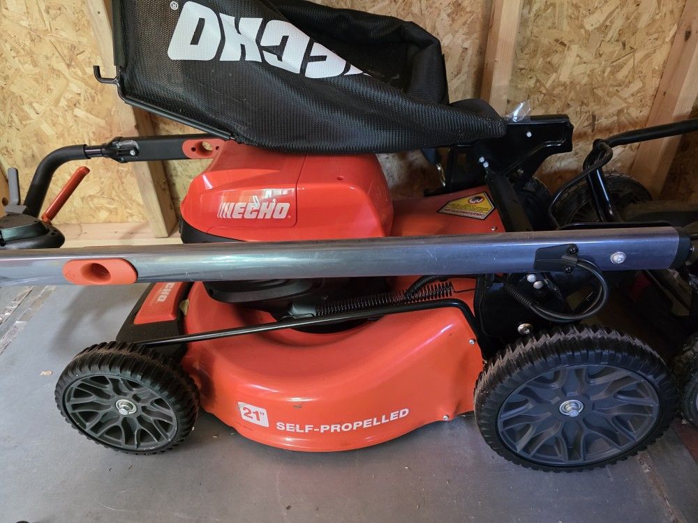 Brand New Echo Self Propelled Mower And Chainsaw