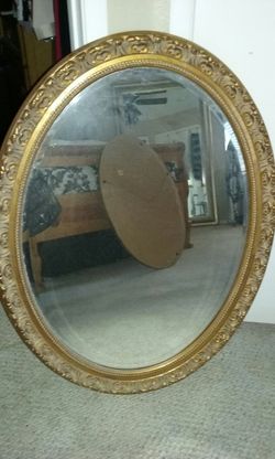 Antique gold color oval mirror