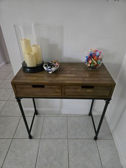 Modern entryway/accent table with two spacious drawers and a warm wood finish.