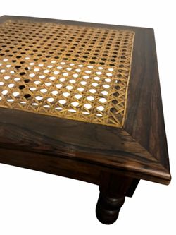 Wooden footstool with cane seat and turned legs