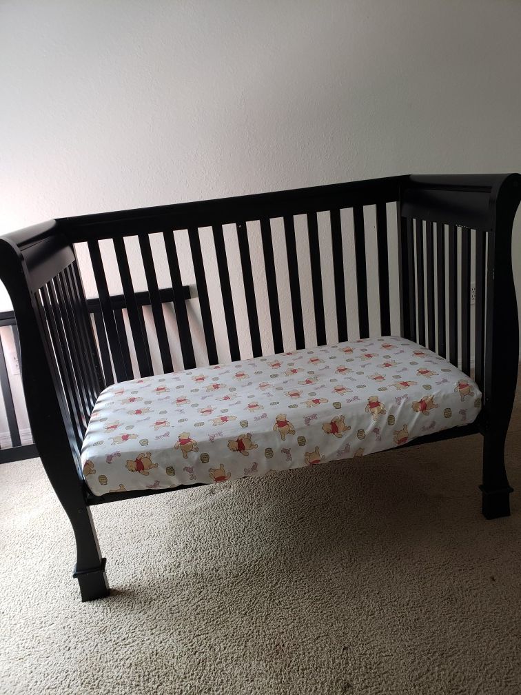 Black crib, changing table and mattress for $60