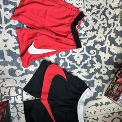 NIKE shorts 2 (large) and 1 shirt (medium)